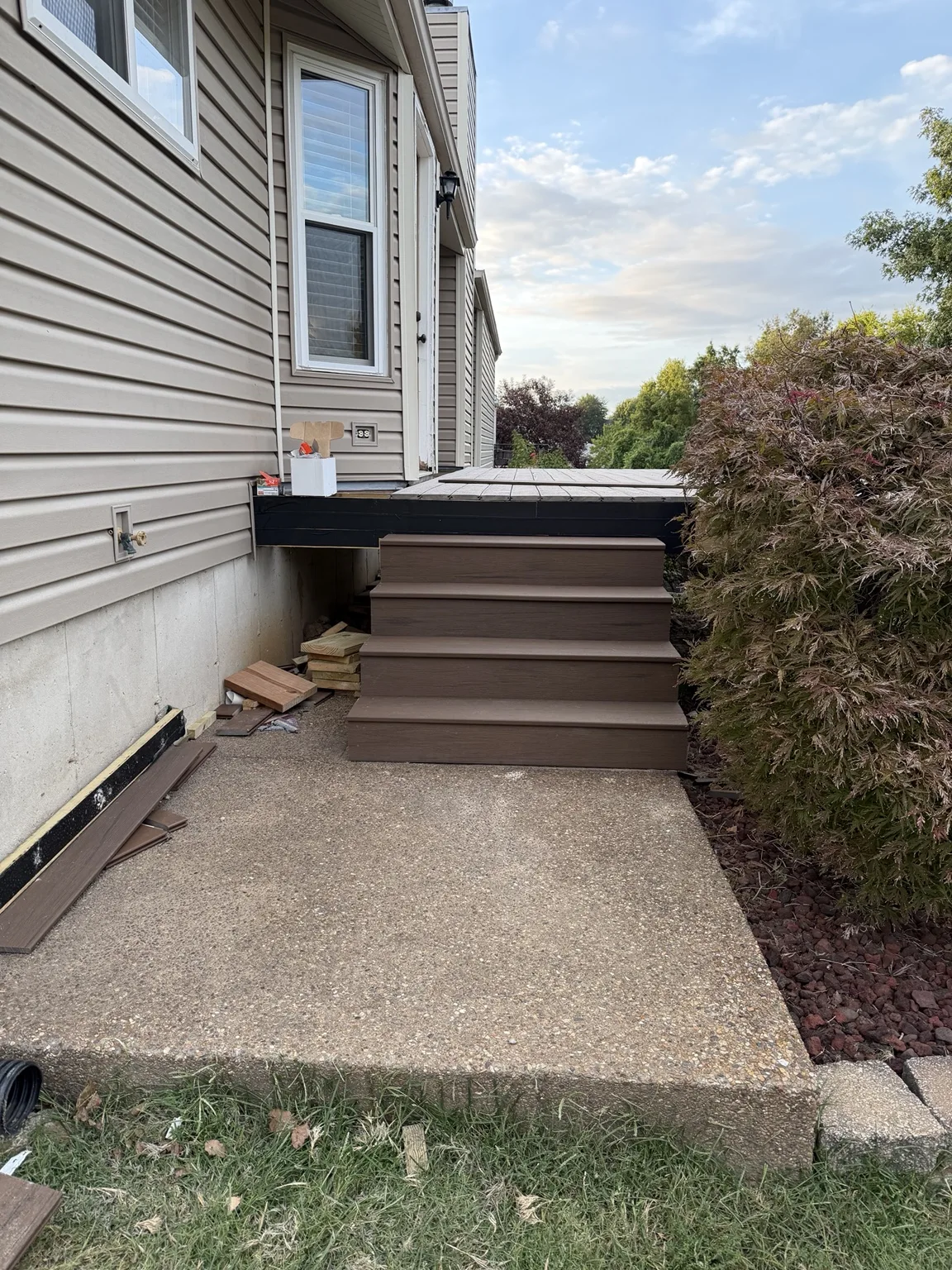 Composite steps leading to a concrete walkway
